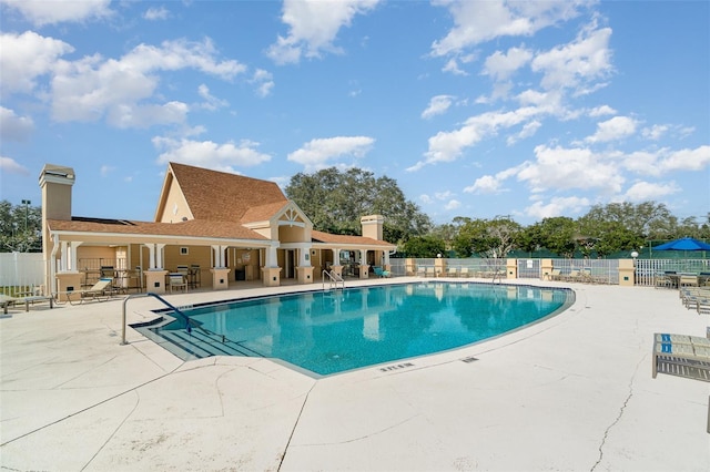 view of swimming pool featuring a patio