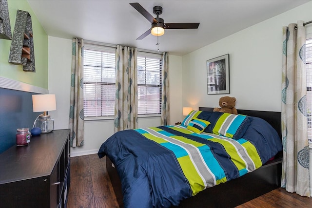 bedroom featuring dark hardwood / wood-style floors and ceiling fan