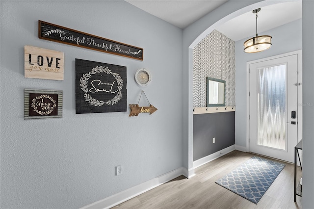 foyer entrance with light wood-type flooring