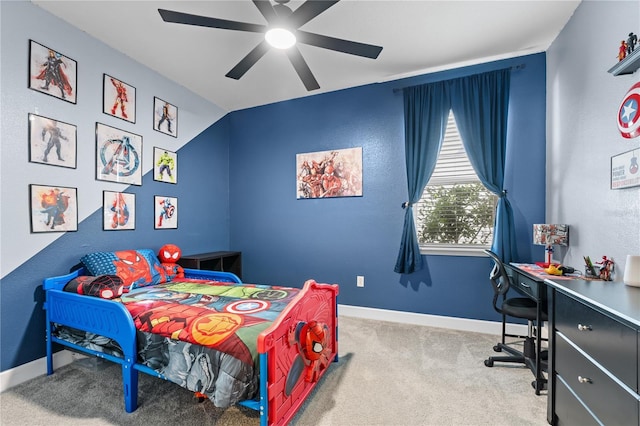 bedroom featuring ceiling fan, lofted ceiling, and light carpet