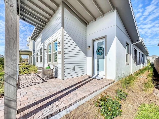 entrance to property with a patio area