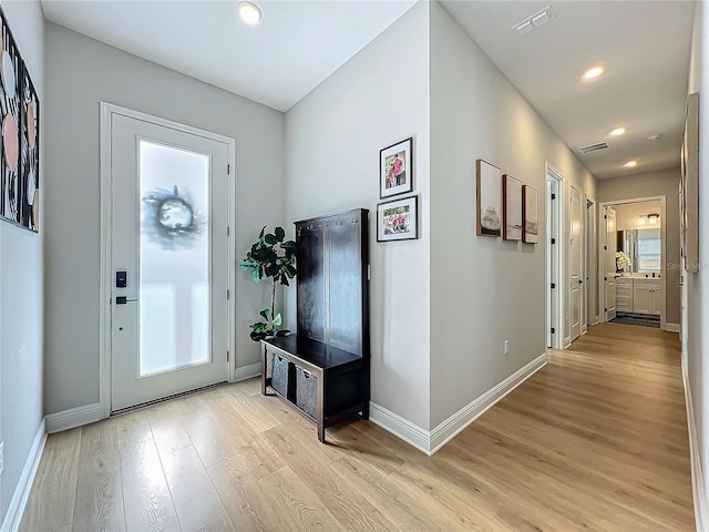 entrance foyer with light hardwood / wood-style floors