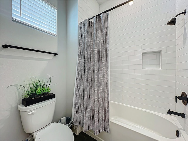 bathroom with shower / bathtub combination with curtain and toilet