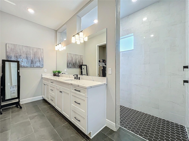 bathroom featuring vanity and a tile shower