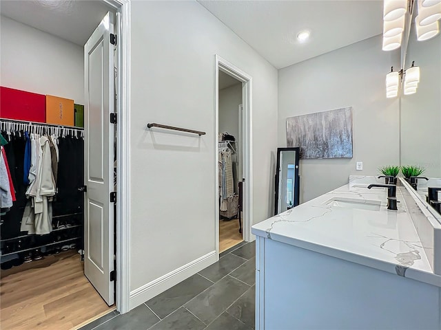 bathroom with vanity and tile patterned flooring