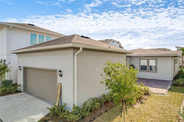 view of property exterior with a garage