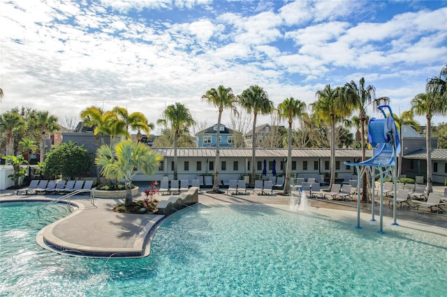 view of pool with pool water feature and a patio area