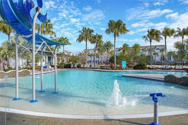 view of swimming pool featuring pool water feature and a water slide