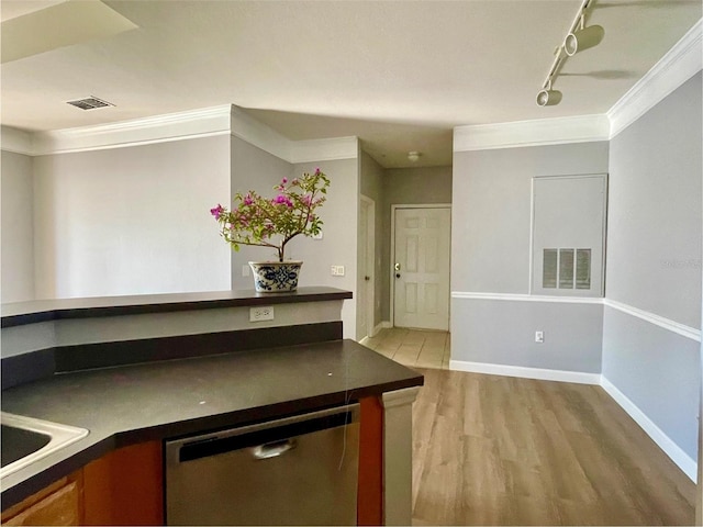 kitchen with dishwasher, crown molding, track lighting, and light wood-type flooring