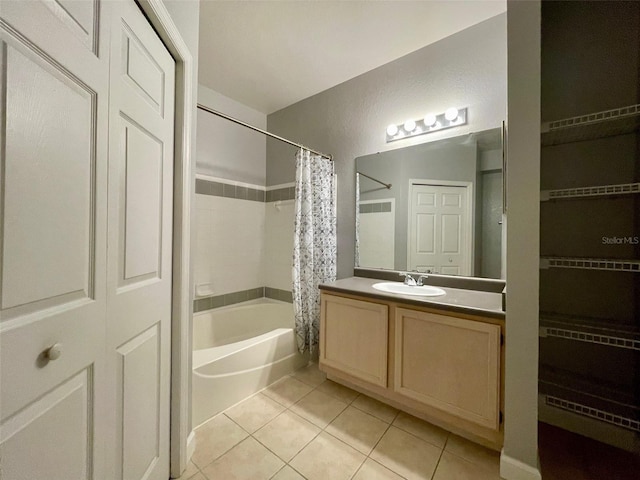 bathroom featuring vanity, tile patterned floors, and shower / bath combination with curtain