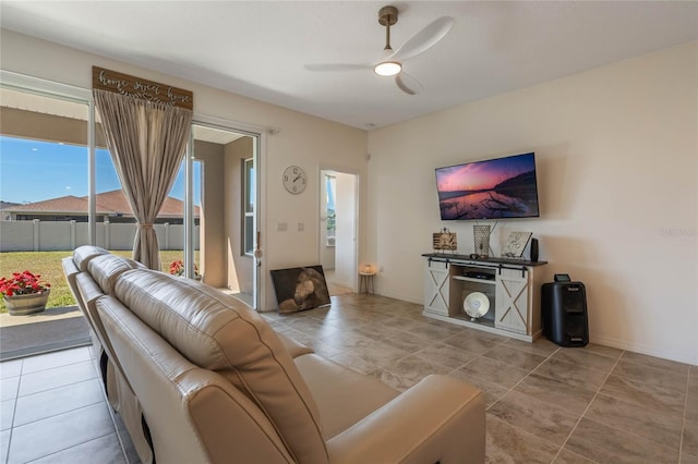 tiled living room with ceiling fan