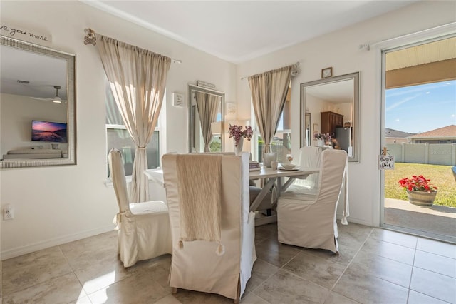 dining space featuring light tile patterned floors