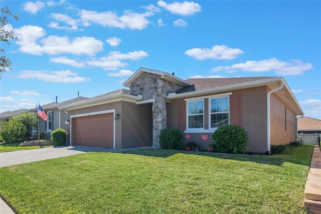 view of front of house featuring a garage and a front yard