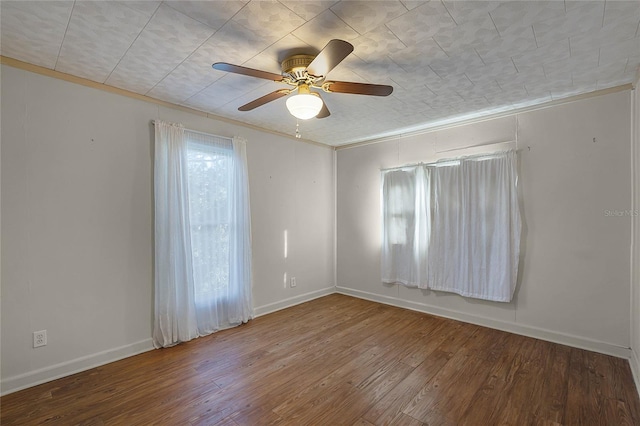 unfurnished room featuring ceiling fan, ornamental molding, and wood-type flooring