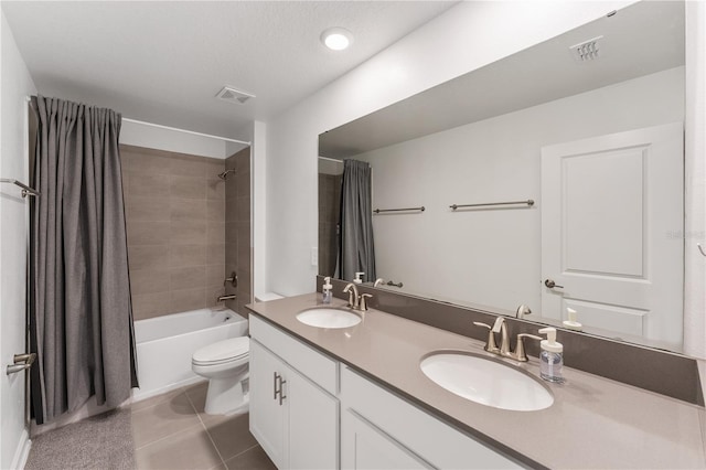 full bathroom featuring tile patterned flooring, shower / bath combo, vanity, and toilet