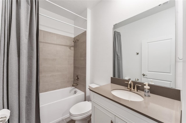 full bathroom featuring vanity, toilet, and tiled shower / bath combo