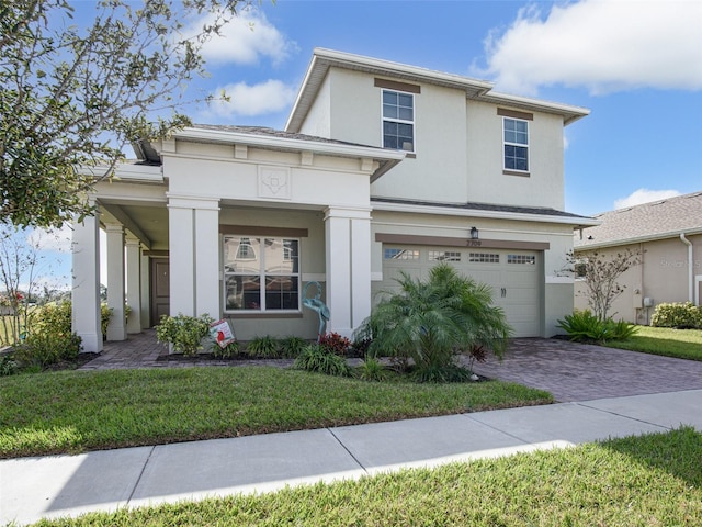 view of front facade featuring a garage and a front yard