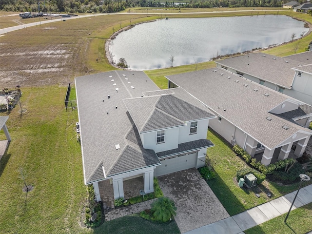 birds eye view of property with a water view