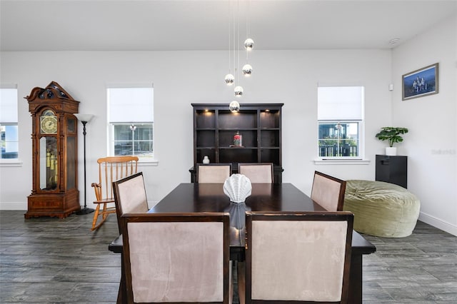 dining area with dark wood-type flooring