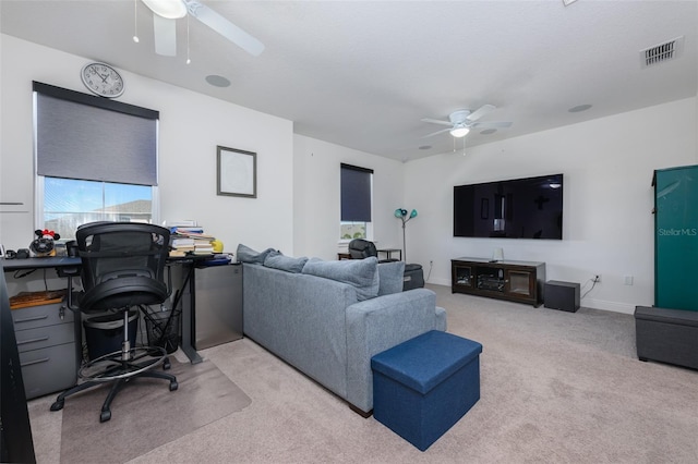 living room featuring light colored carpet and ceiling fan