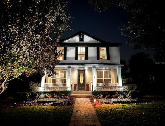 view of front of property featuring covered porch