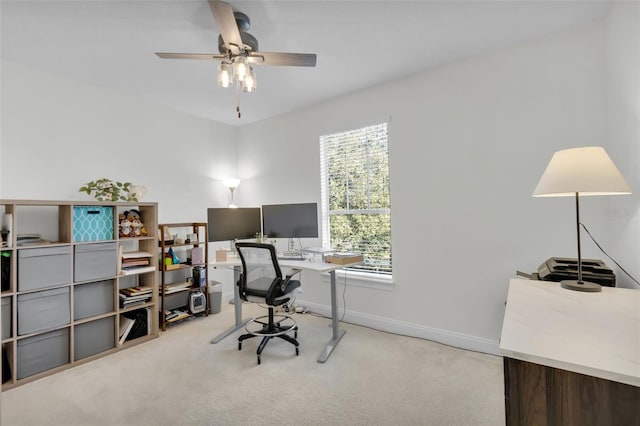 office space with ceiling fan and light colored carpet