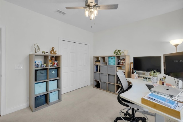 office space with light colored carpet and ceiling fan