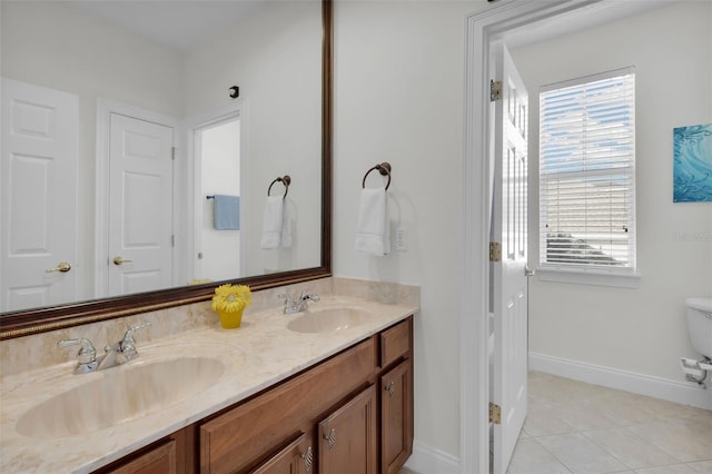 bathroom with tile patterned floors, vanity, and toilet