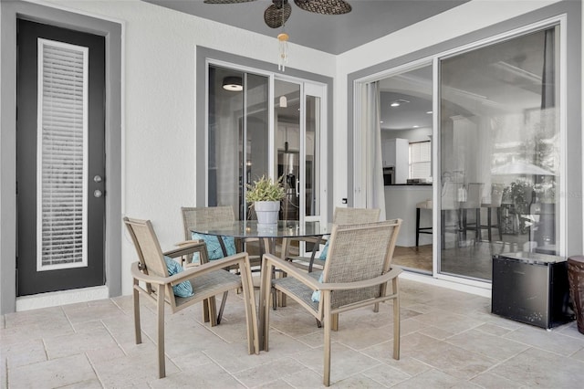 view of patio featuring ceiling fan