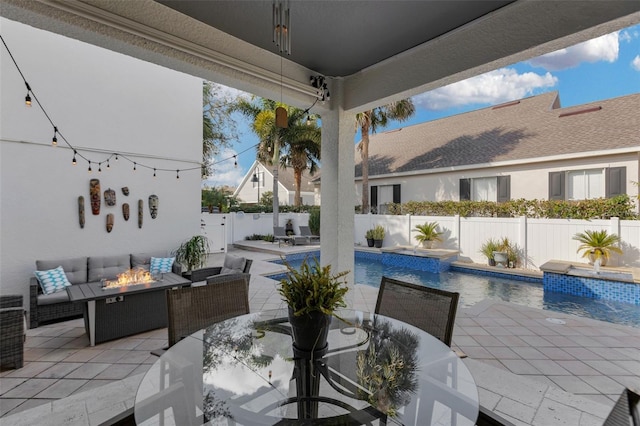 view of patio featuring a fenced in pool and an outdoor fire pit