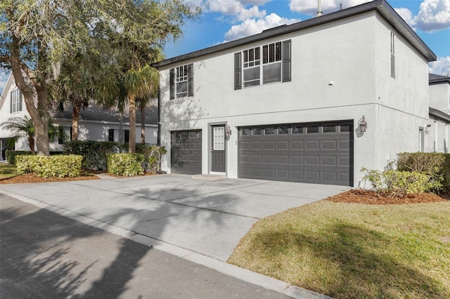 view of front of house with a garage and a front yard