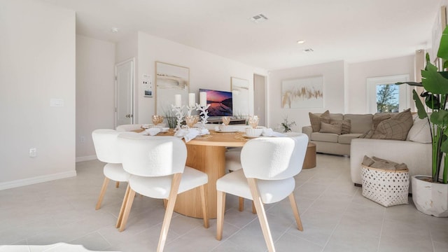 dining area with light tile patterned floors