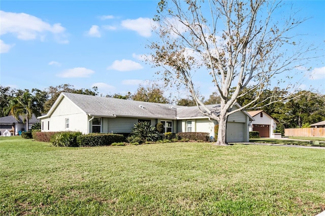 single story home with a garage and a front yard