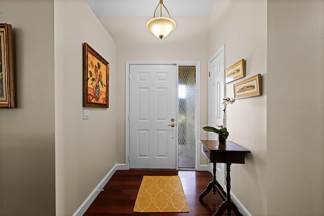 entryway with dark wood-type flooring