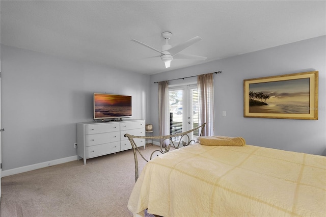 carpeted bedroom featuring access to exterior and ceiling fan