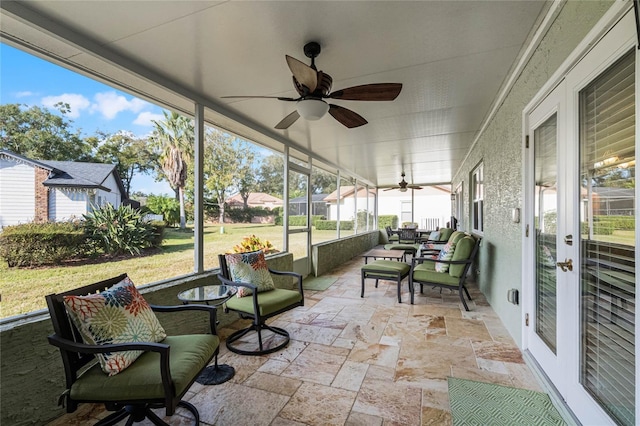 sunroom / solarium with ceiling fan