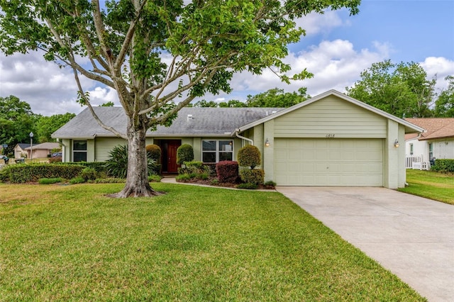 single story home featuring a garage, driveway, and a front yard