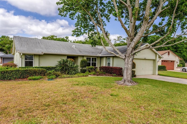 single story home featuring a garage, a front lawn, and concrete driveway