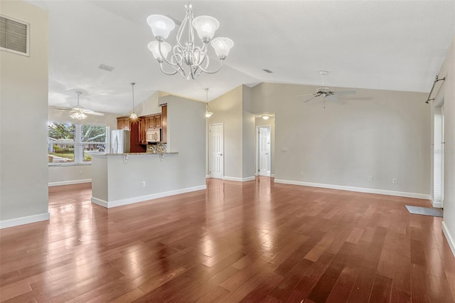 unfurnished living room with visible vents, light wood-type flooring, baseboards, ceiling fan with notable chandelier, and lofted ceiling