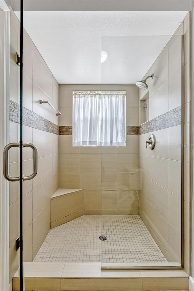 bathroom with a stall shower