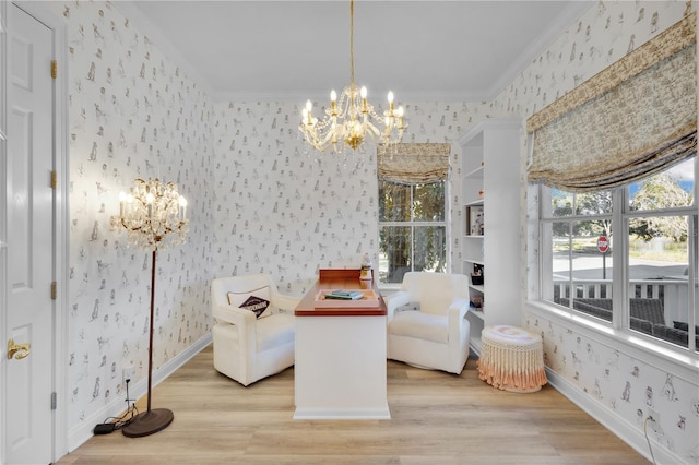 living area with ornamental molding, light hardwood / wood-style floors, and a chandelier