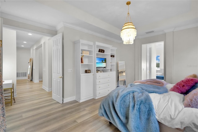 bedroom featuring ornamental molding, an inviting chandelier, and light hardwood / wood-style floors