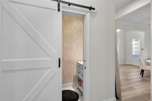 bathroom featuring hardwood / wood-style floors and ornamental molding