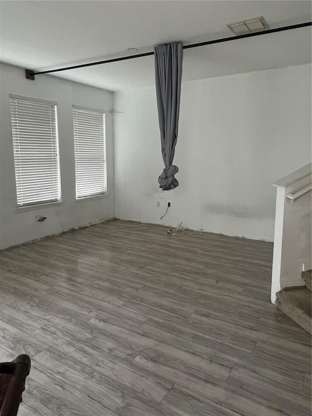 unfurnished room featuring hardwood / wood-style floors