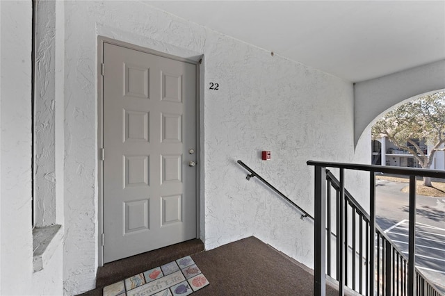 entrance to property featuring a balcony