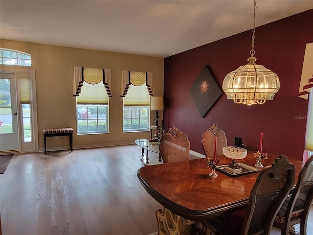 dining room featuring a chandelier and hardwood / wood-style floors