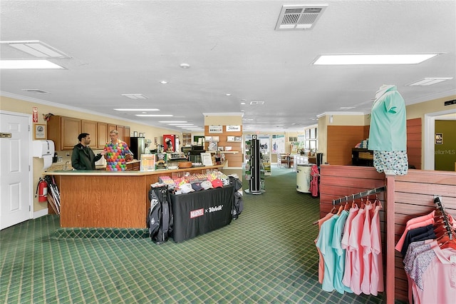 misc room with ornamental molding and a textured ceiling