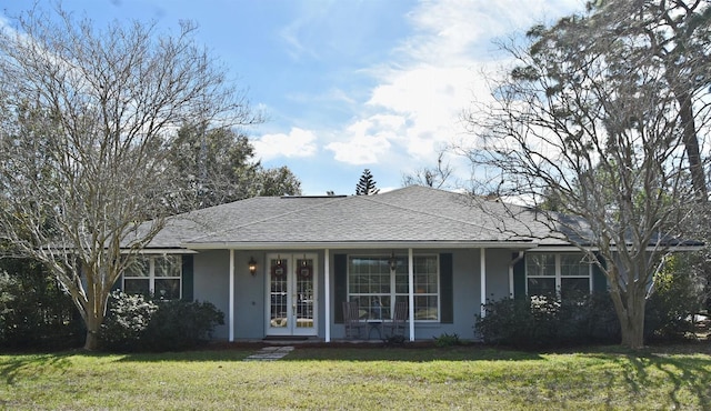 single story home featuring a front yard and a porch