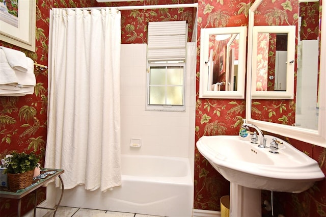 bathroom with tile patterned flooring and shower / bath combo with shower curtain