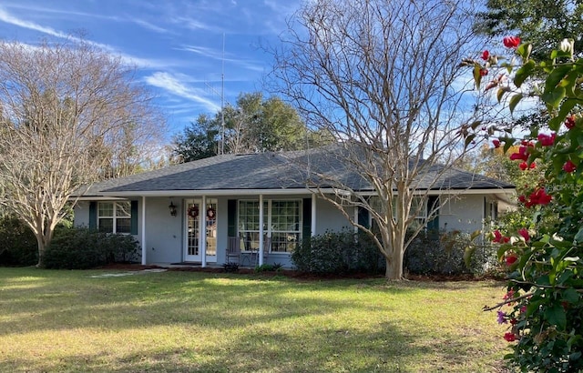 single story home featuring a porch and a front yard